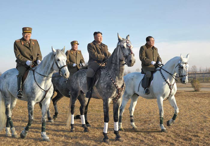A younger Kim riding with his inner circle—some of which have since gotten the axe—during a military inspection. Image circa 2012. 