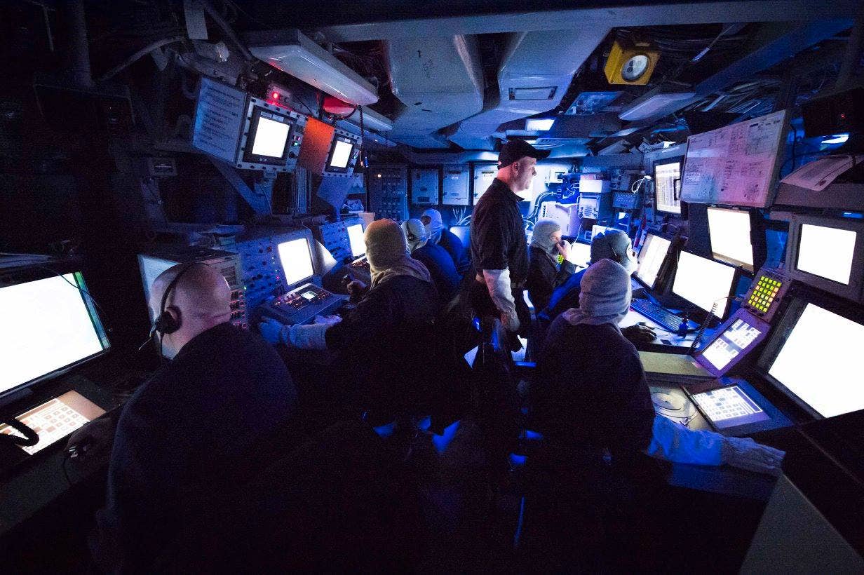 sailors_monitor_ships_self_defense_systems_during_general_quarters_in_the_combat_information_center_of_the_amphibious_transport_dock_ship_uss_san_antonio_.jpg