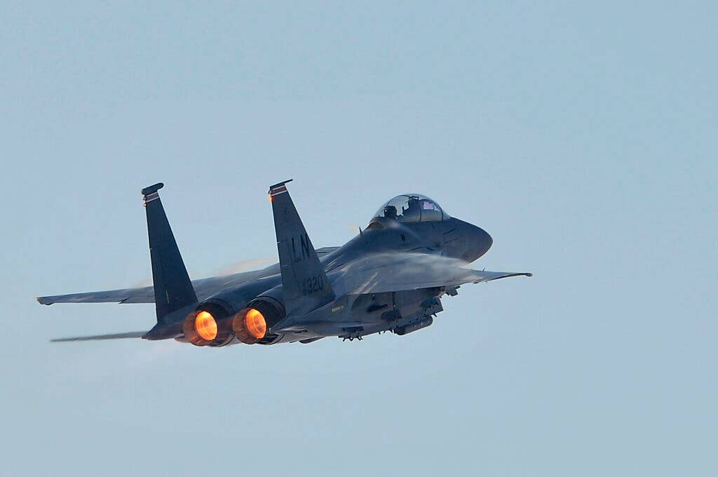 An F-15E Strike Eagle from the 48th Fighter Wing performs during a 20th-anniversary commemoration event for the type at the base in February 2012.  The first F-15E arrived at Lakenheath in February 1992. <em>U.S. Air Force photo by Staff Sgt. Conner Estes</em>
