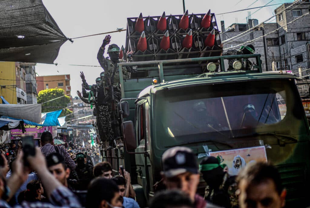 GAZA, PALESTINE - 2021/05/27: Members of the Izz al-Din al-Qassam Brigades, the military wing of Hamas display rockets during a military parade on the Streets in Khan Yunis, southern Gaza Strip. (Photo by Yousef Masoud/SOPA Images/LightRocket via Getty Images)