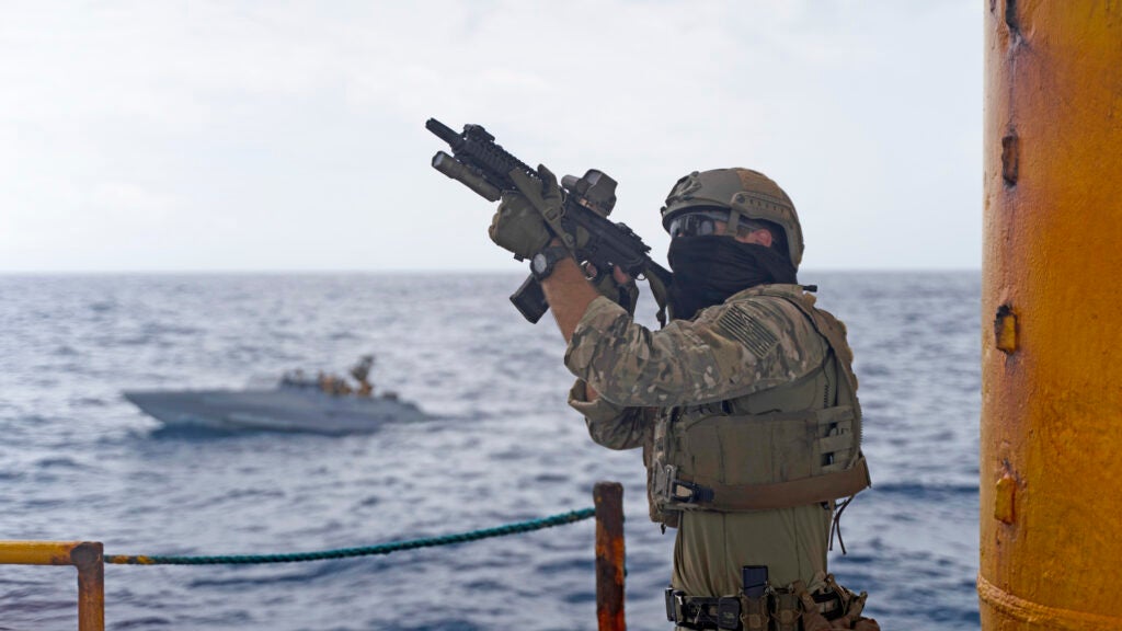 A U.S. Navy SEAL with Special Warfare Group conducts maritime security operations together during exercise Balikatan 22 off the coast of Palawan, Philippines, April 7, 2022. Balikatan is an annual exercise between the Armed Forces of the Philippines and U.S. military designed to strengthen bilateral interoperability, capabilities, trust and cooperation built over decades of shared experiences. Balikatan, Tagalog for 'shoulder-to-shoulder' is a longstanding bilateral exercise between the Philippines and the United States highlighting the deep-rooted partnership between both countries. BK22 is the 37th iteration of the exercise and coincides with the 75th anniversary of U.S. Philippine security cooperation. (U.S. Marine Corps photo by Sgt. Mario A. Ramirez)