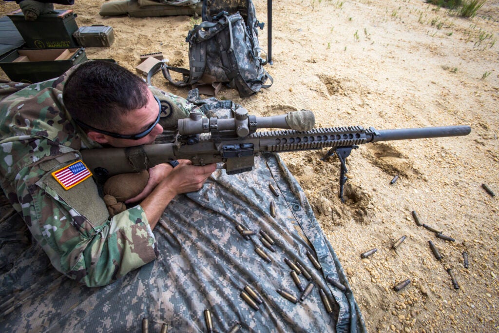 U.S. Army Christopher Ashey, 2nd Battalion, 113th Infantry, New Jersey Army National Guard, fires a M110 Semi-Automatic Sniper System during joint training with the 113th Infantry and the Albanian special forces sniper teams at Joint Base McGuire-Dix-Lakehurst, N.J., Aug. 15, 2018. Albania has been a state partner with New Jersey since 2001. The National Guard State Partnership Program is a U.S. Department of Defense program managed by the National Guard that links U.S. States with partner countries around the world for the purpose of supporting the security cooperation objectives of the geographic Combatant Commanders. (New Jersey National Guard photo by Mark C. Olsen)