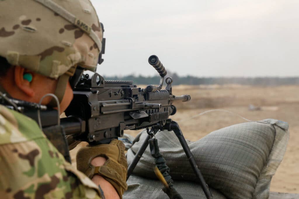 U.S. Army Spc. Felípe Aragón zeroes his M249 light machine gun at Zagan, Poland, March 17, 2022. U.S. Army National Guard photo by Spc. Hassani Ribera