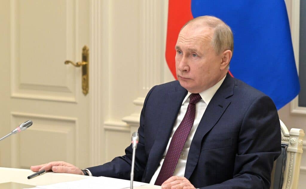 Russian President Vladimir Putin gives the instruction to start a comprehensive drill involving strategic forces and personally monitors the launch of ballistic missiles in a drill from the Kremlin, in Moscow, on February 19, 2022. <em>Kremlin Press Service/Anadolu Agency via Getty Images</em>