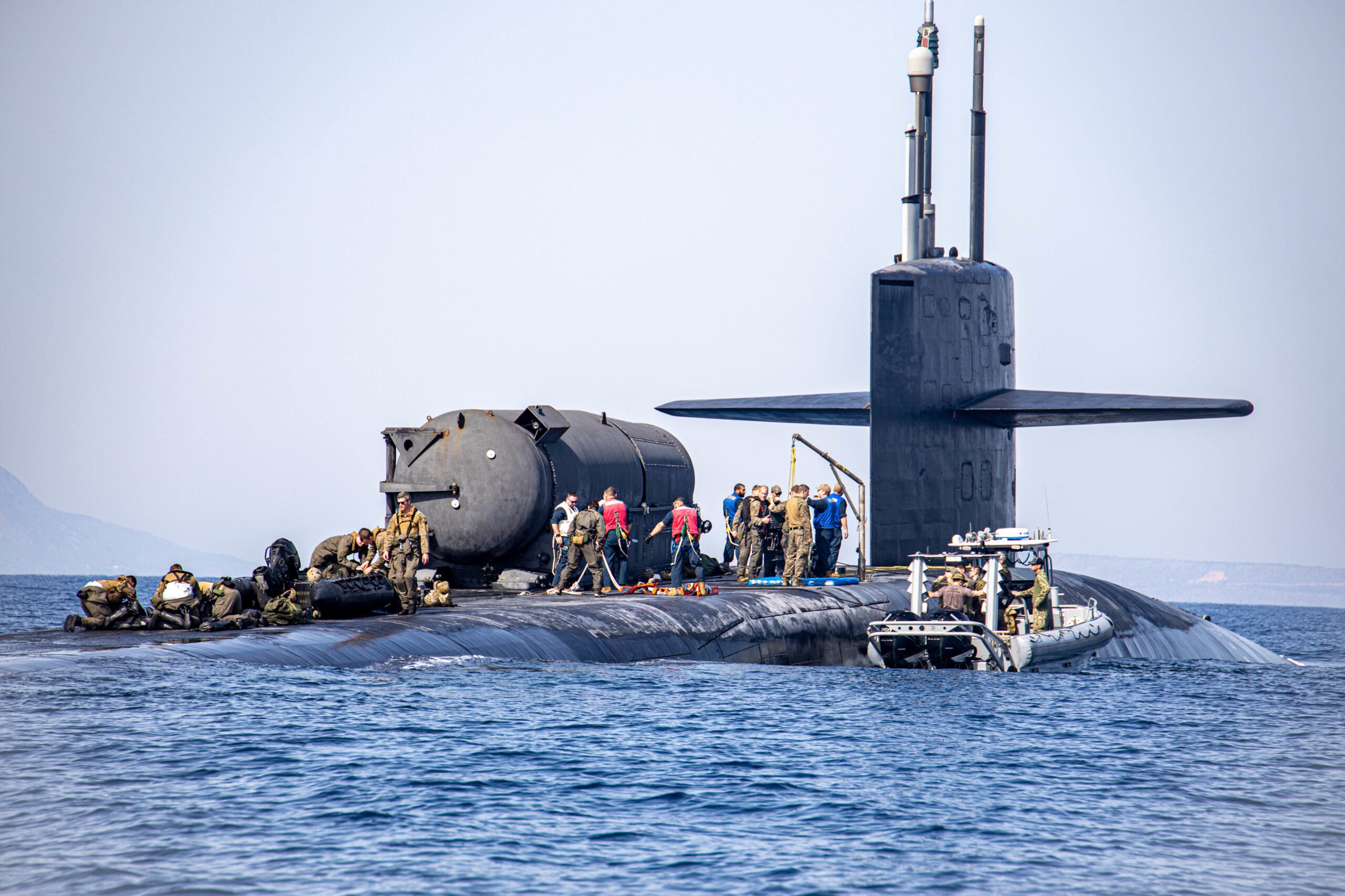 SOUDA BAY (March 27, 2022) – The Ohio-class guided-missile submarine USS Georgia (SSGN 729) near Souda Bay, Greece, during training with U.S. Marines from Task Force 61/2 (TF-61/2), conducting launch and recovery training with their combat rubber raiding craft, March 27, 2022. TF-61/2 will temporarily provide command and control support to the commander of U.S. Sixth Fleet, to synchronize Navy and Marine Corps units and capabilities already in theater, in support of regional Allies and Partners and U.S. national security interests. (U.S. Marine Corps photo by Sgt Dylan Chagnon/Released)