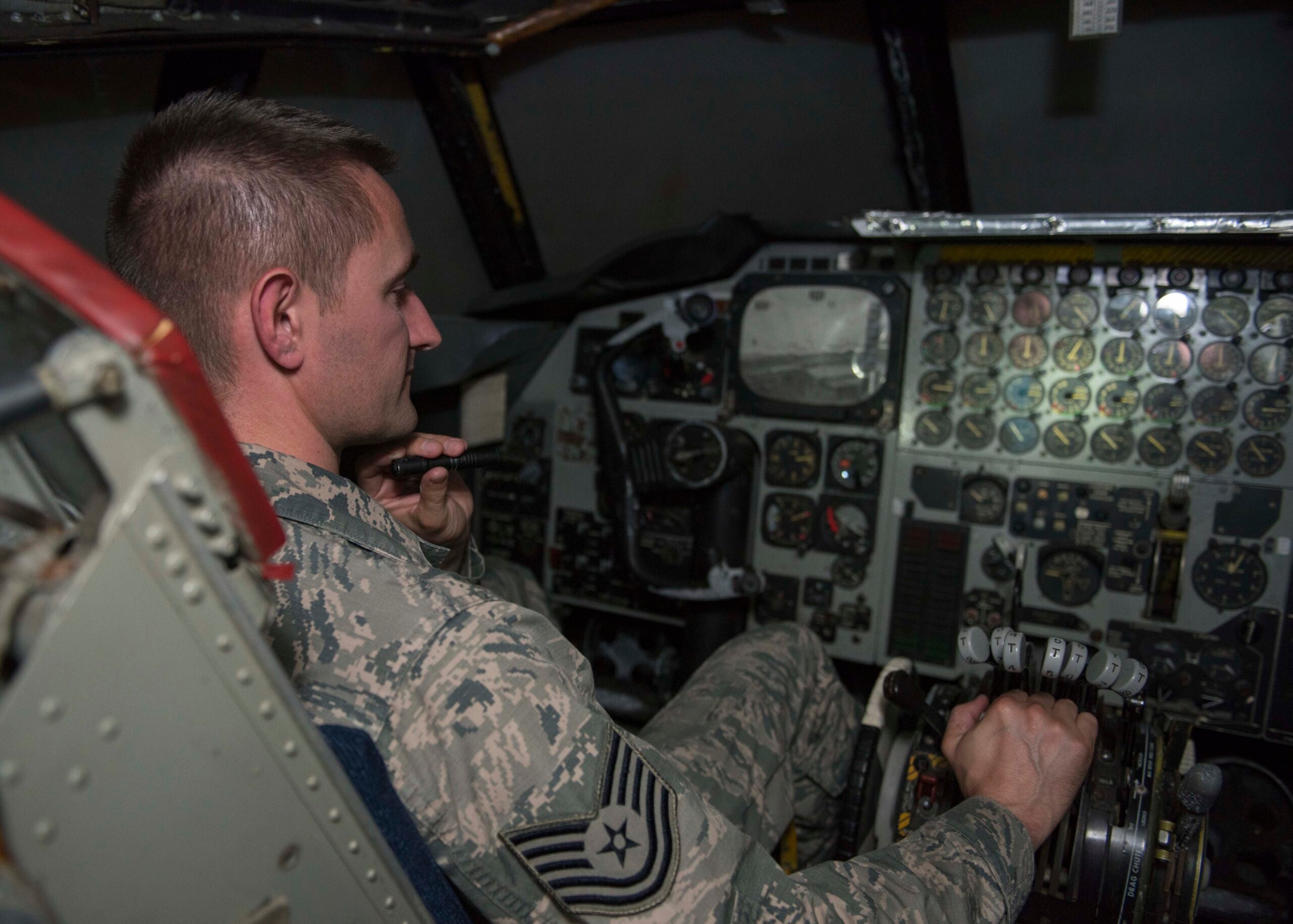 Tech. Sgt. Benjamin Whitfield, 92nd Air Refueling Wing historic property custodian, sits in the cockpit of a vintage B-52 simulator dubbed “Alpine Clover" July 10, 2017, at Fairchild Air Force Base, Washington. Revolutionary during its time, these simulators could be driven by rail to any base that needed training. (U.S. Air Force photo / A1C Ryan Lackey)