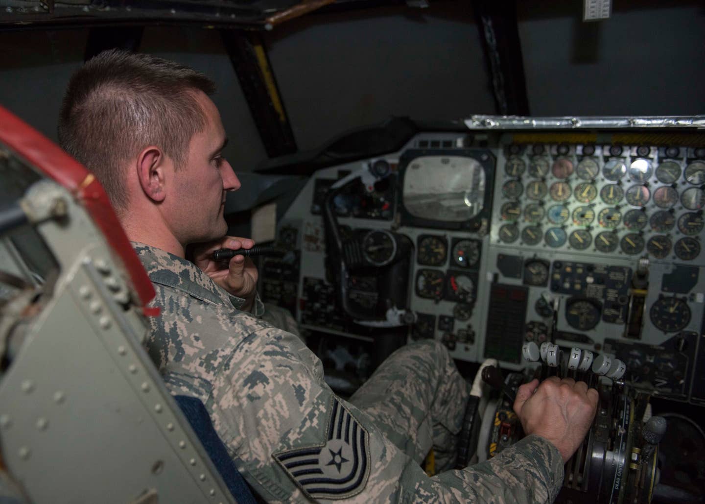 Tech. Sgt. Benjamin Whitfield, 92nd Air Refueling Wing historic property custodian, sits in the cockpit of a vintage B-52 simulator dubbed <em>Alpine Clover</em> at Fairchild Air Force Base. <em>U.S. Air Force photo / Airman 1st Class Ryan Lackey</em>