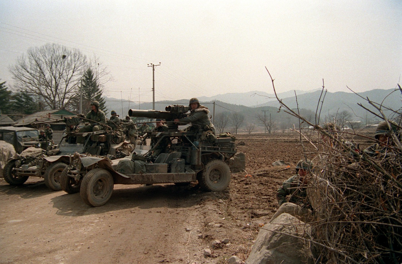 A Chenowth Racing Products Fast Attack Vehicle (FAV) equipped with a TOW anti-tank missile, in front, and another with a .50 caliber M2 machine gun behind it. Army photo