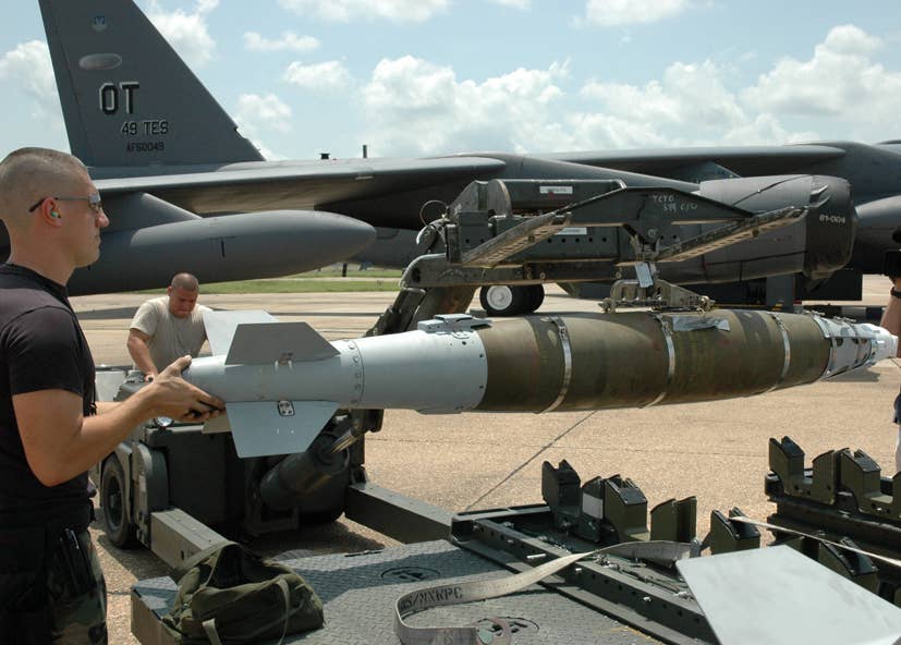 Laser Joint Direct Attack Munitions are prepared for loading on a B-52 from the 49th Test and Evaluation Squadron at Barksdale Air Force Base, Louisiana. <em>Boeing</em><br>
