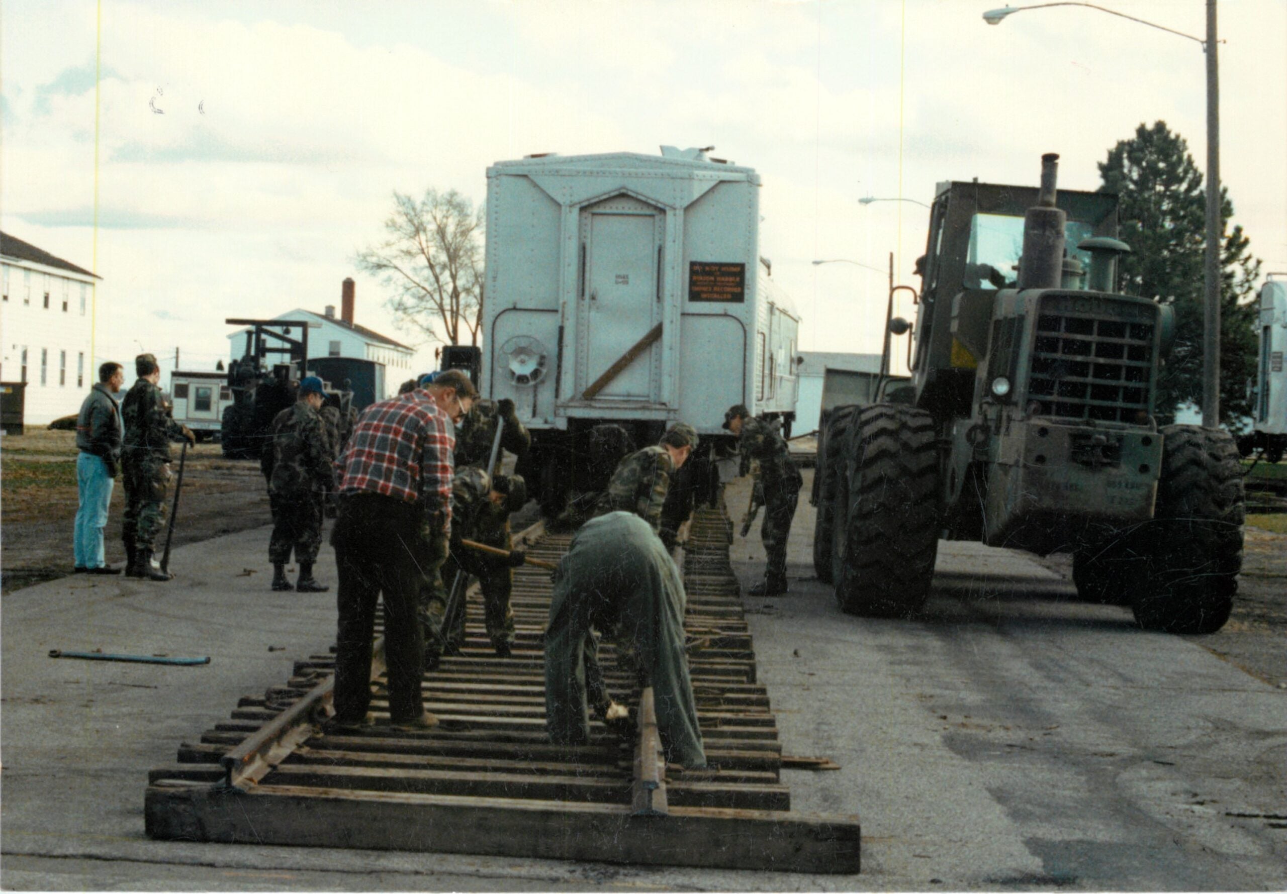 Volunteer workers lay tracks as part of Operation Cannonball Nov. 8, 1990, at Fairchild Air Force Base, Washington. (U.S. Air Force photo)