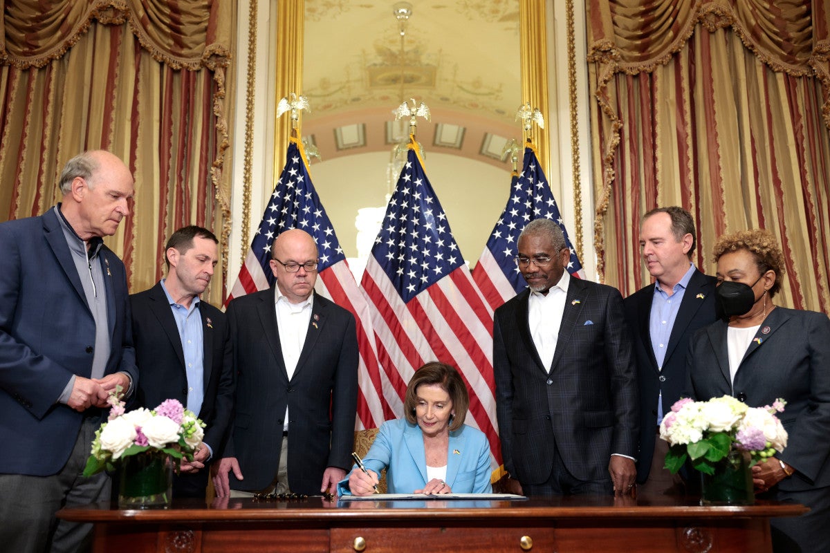 WASHINGTON, DC - MAY 02:  U.S. House Speaker Nancy Pelosi (D-CA) signs the Ukraine Democracy Defense Lend-Lease Act of 2022 at the Capitol Building on May 02, 2022 in Washington, DC. Pelosi led a Congressional delegation over the weekend to meet with Ukrainian President Volodymyr Zelenskyy in Kyiv. For the bill signing, Pelosi was joined by members of the delegation (L-R) Reps. Bill Keating (D-MA), Jason Crow (D-CO), Jim McGovern (D-MA), Gregory W. Meeks (D-NY), Adam Schiff (D-CA) and Barbara Lee (D-CA). (Photo by Anna Moneymaker/Getty Images)