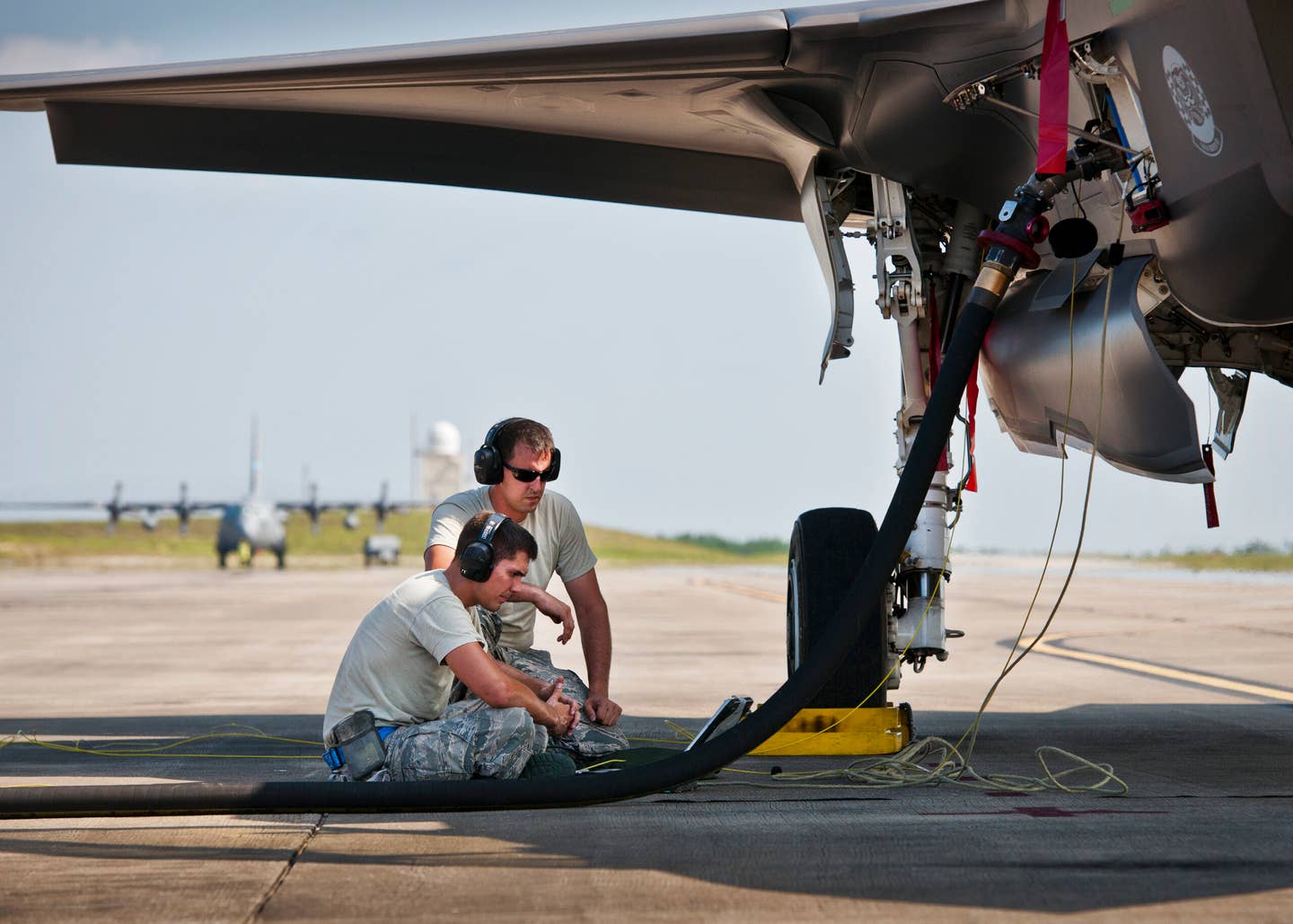 Staff Sgts Todd Bedo and Wayne Singleton, 33rd Fighter Wing, monitor a laptop connected to an F-35A Lightning II during post flight checks after the aircraft landed at Duke Field, Fla. (U.S. Air Force photo/Tech. Sgt. Sam King)