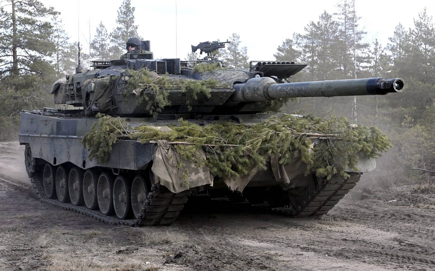 A Leopard 2 tank of the Finnish Army during the Arrow 22 exercise at the Niinisalo garrison in Kankaanpää, western Finland, earlier this month. <em>Photo by HEIKKI SAUKKOMAA/Lehtikuva/AFP via Getty Images</em>