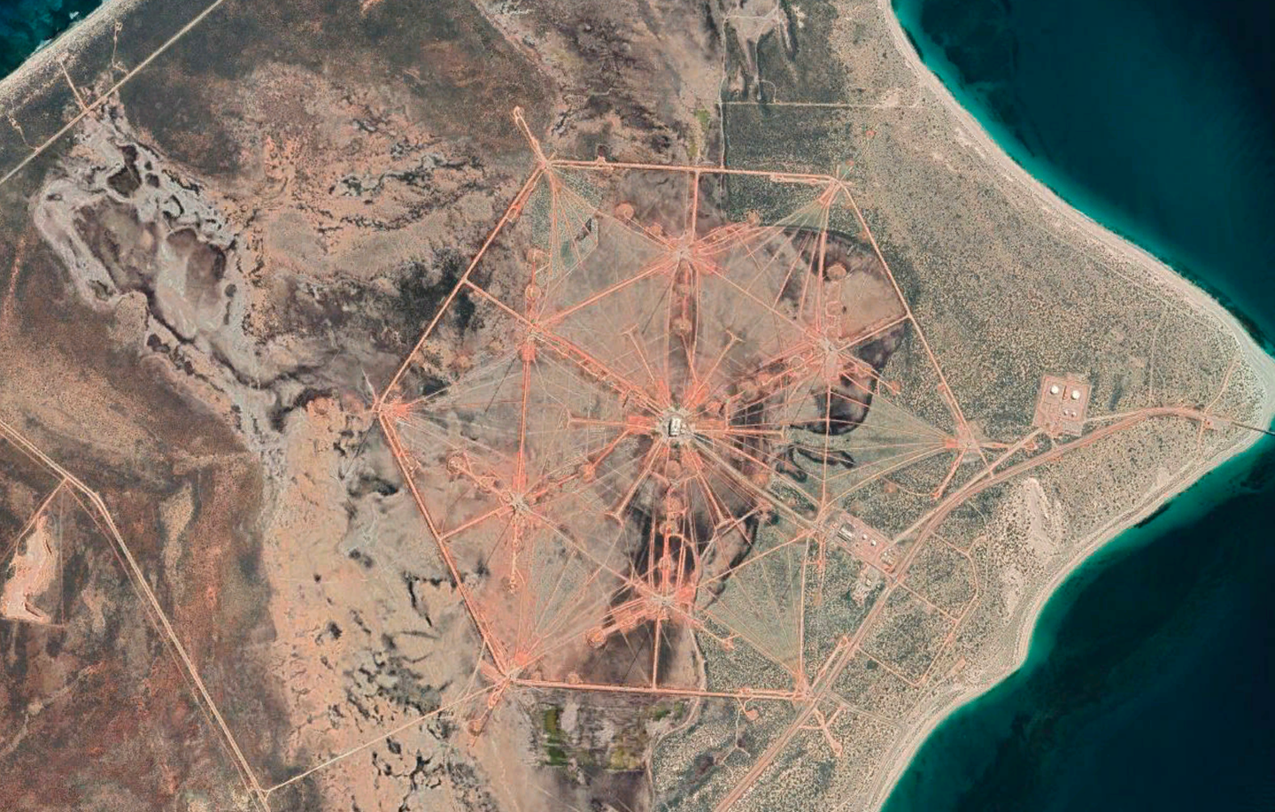 A satellite image of Naval Communication Station Harold E. Holt&nbsp;showing the prominent array of 13 radio towers used for VLF communications. <em>Google Earth</em>