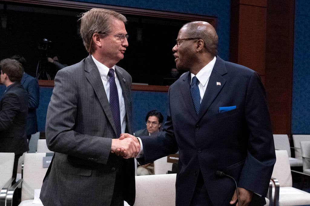 Rep. Tim Burchett, R-Tenn., left, shakes hands with Defense Undersecretary for Intelligence and Security Ronald Moultrie, after a House Counterterrorism, Counterintelligence, and Counterproliferation Subcommittee, hearing on "Unidentified Aerial Phenomena, on Capitol Hill in Washington, DC on May 17, 2022. (Photo by Jose Luis Magana / AFP)