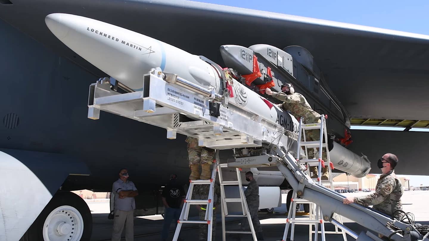 US Air Force personnel attach an AGM-183A captive-carry test article to a B-52H bomber.