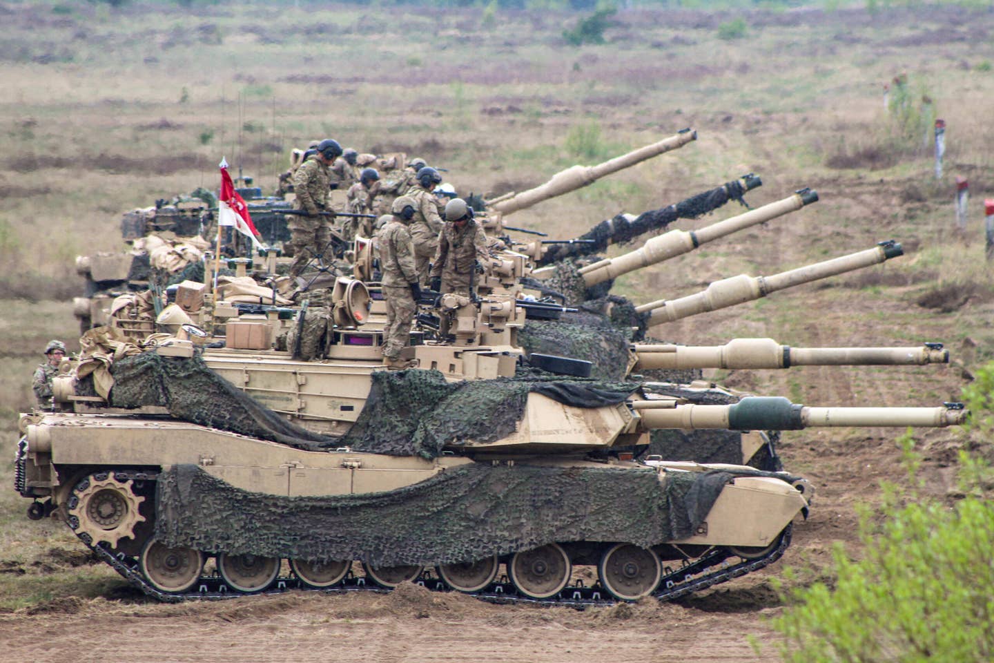 U.S. Army M1A2 Abrams tanks at Mielno Range in Drawsko Pomorskie, Poland, in May 2022. <em>U.S. Army National Guard photo by Spc. Hedil Hernández</em>
