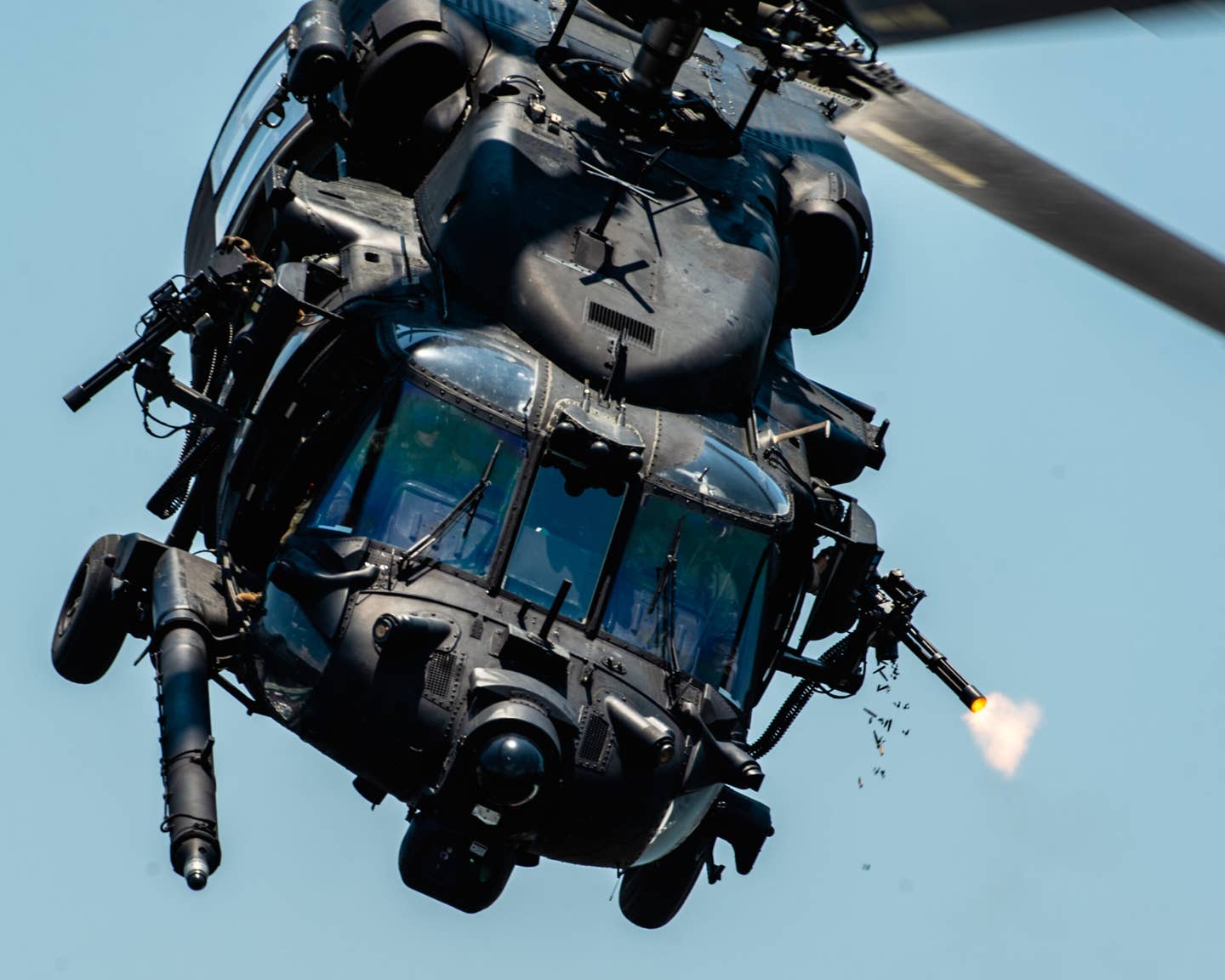 U.S. Special Operations Forces members fly over Tampa Bay, Florida in a U.S. Army MH-60 helicopter during a SOF capabilities demonstration on May 18, 2022. <em>Air Force photo by Staff Sgt. Alexander Cook</em>