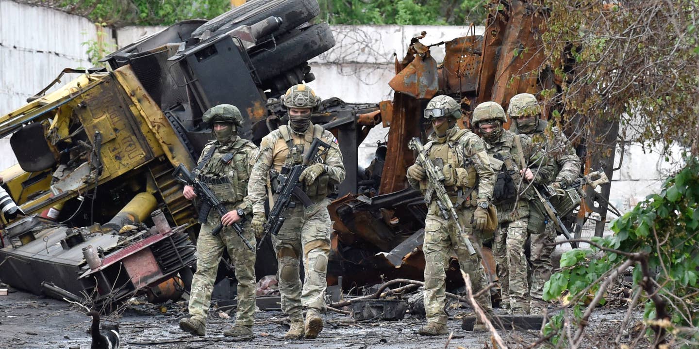 Russian servicemen patrol the destroyed part of the Ilyich Iron and Steel Works in Ukraine's port city of Mariupol on May 18, 2022, amid the ongoing Russian military action in Ukraine.