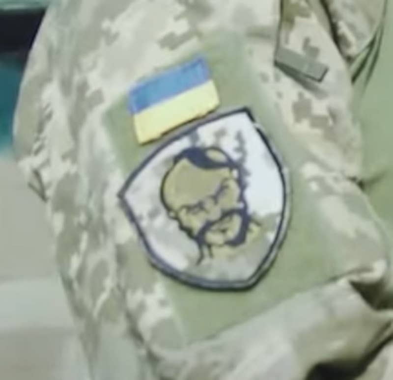 A patch featuring a stylized Cossack sporting an Osedelets hairdo.
