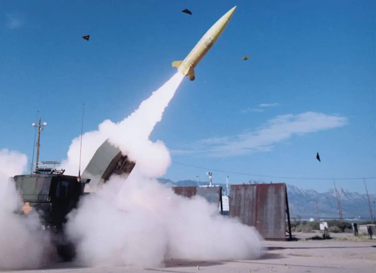 An M142 HIMARS launches an ATACMS missile. <em>Lockheed Martin</em>