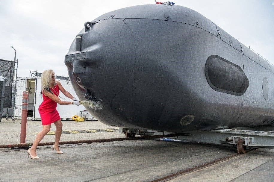 Christening of the first Orca test asset at Huntington Beach, California, on April 28, 2022. The vehicle was christened by Dorothy Engelhardt, Director, Unmanned Systems, Deputy Assistant Secretary of the Navy (Ships). <em>Boeing</em>