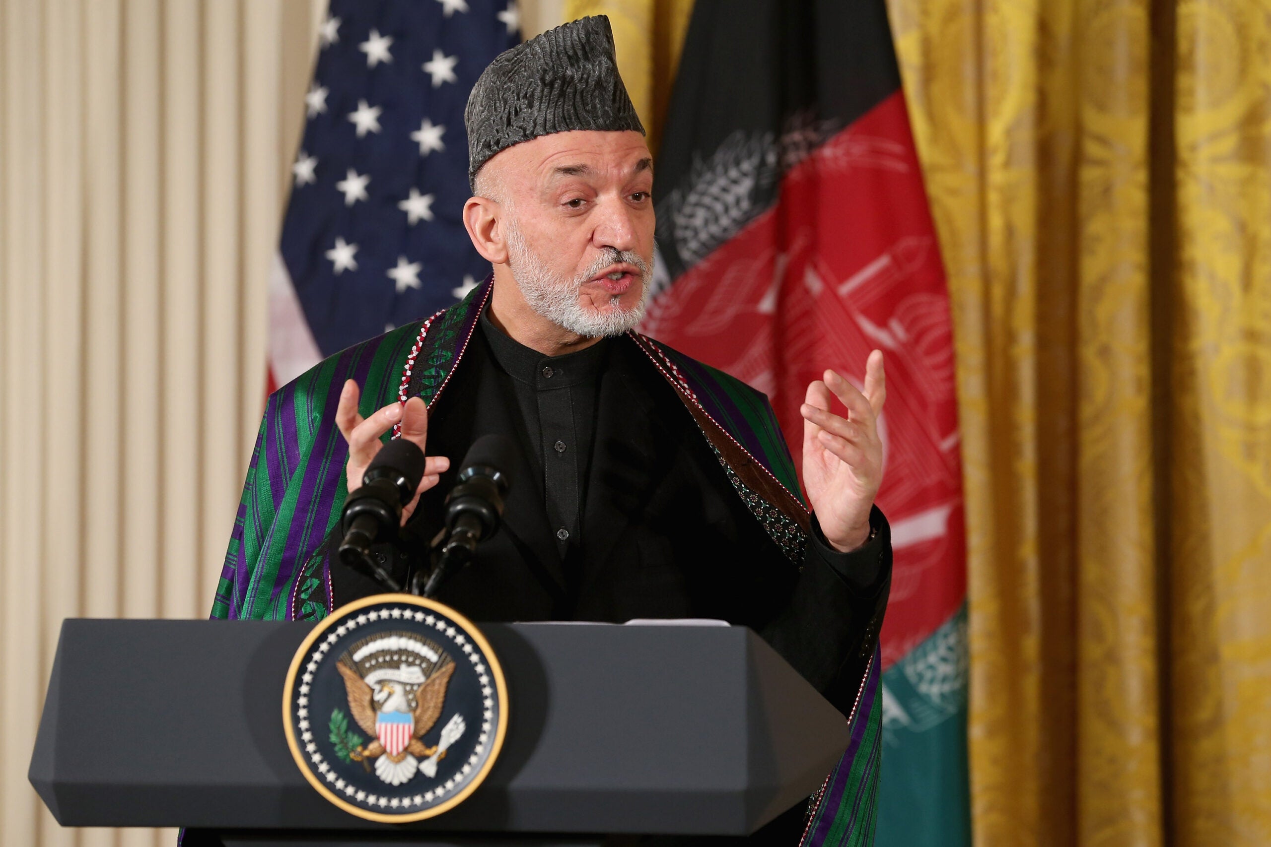 WASHINGTON, DC - JANUARY 11:  Afghan President Hamid Karzai speaks during a joint news conference with U.S. President Barack Obama in the East Room of the White House January 11, 2013 in Washington, DC. Karzai is in Washington for face-to-face meetings with Obama and senior members of his administration about the future of American commitment to Afghanistan and when troops may leave the country after more than 10 years of war.  (Photo by Chip Somodevilla/Getty Images)