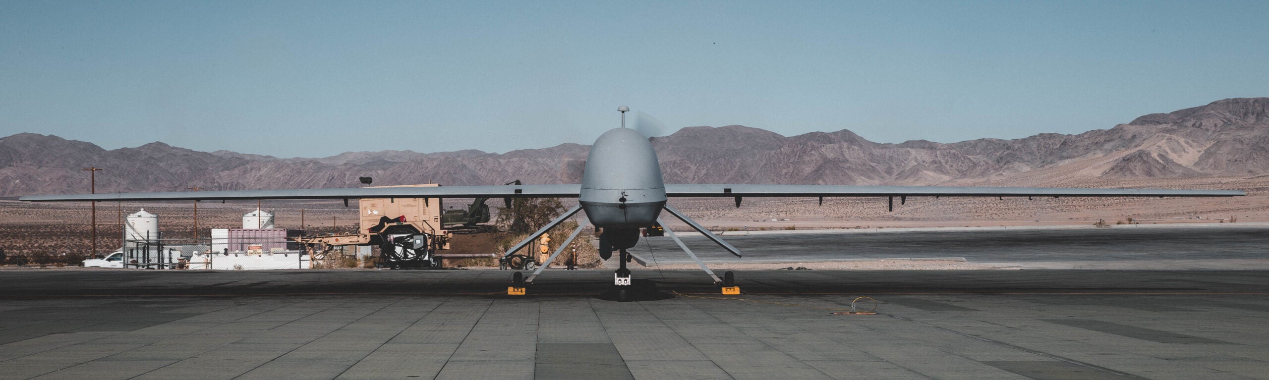 A U.S. Army MQ-1C Gray Eagle with B company, 229th Aviation Regiment known as "Flying Tigers" goes through preflight checks at the Air Combat Element landing strip, Marine Corps Air Ground Combat Center (MCAGCC), Twentynine Palms, Calif., Nov. 7, 2019. The Flying Tigers are supporting U.S. Army Special Operation Soldiers with 3rd Battalion, 3rd Special Forces Group (Airborne) with intelligence, surveillance, target acquisition, and reconnaissance during their tactical recovery of aircraft personnel training. (U.S. Marine Corps photo by Cpl. William Chockey)