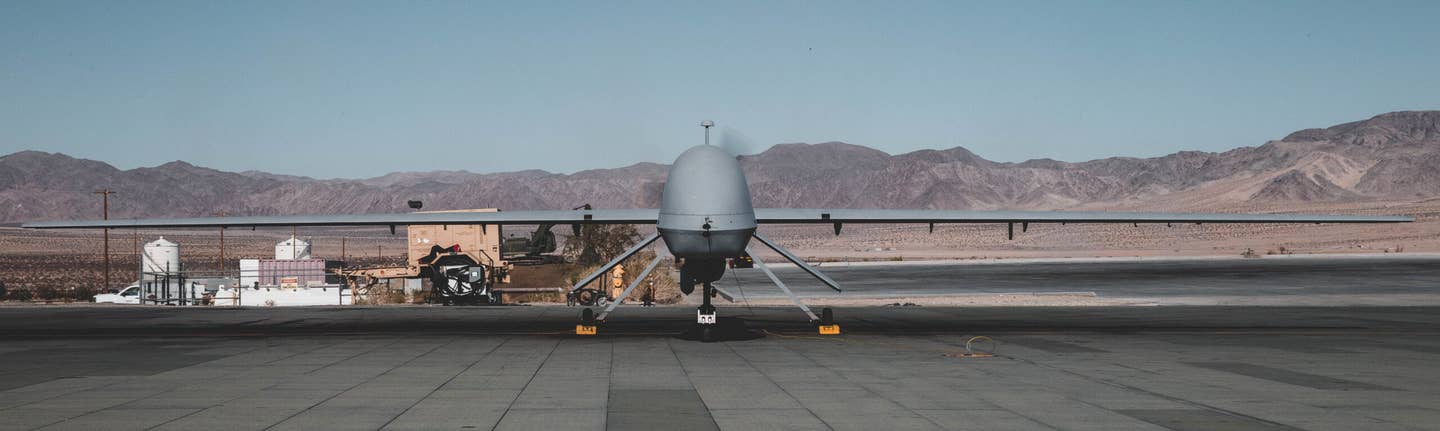A U.S. Army MQ-1C Gray Eagle with B company, 229th Aviation Regiment known as &quot;Flying Tigers&quot; goes through preflight checks at the Air Combat Element landing strip, Marine Corps Air Ground Combat Center (MCAGCC), Twentynine Palms, Calif., Nov. 7, 2019. The Flying Tigers are supporting U.S. Army Special Operation Soldiers with 3rd Battalion, 3rd Special Forces Group (Airborne) with intelligence, surveillance, target acquisition, and reconnaissance during their tactical recovery of aircraft personnel training. (U.S. Marine Corps photo by Cpl. William Chockey)