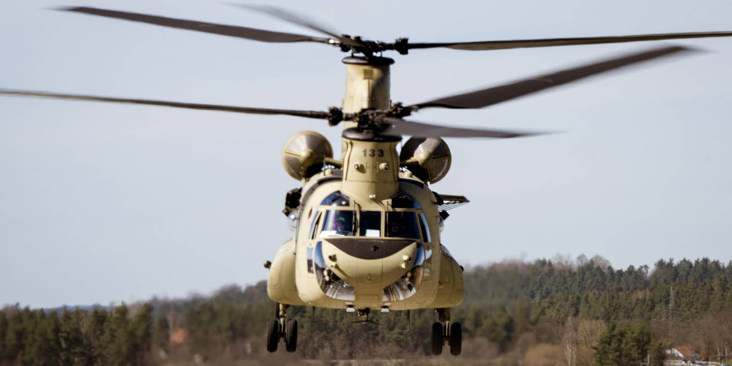 A U.S. Army CH-47F Chinook helicopter from Bravo Company, 1-214th General Support Aviation Battalion, 12th Combat Aviation Brigade, “Big Windy”, prepares to land during an air movement of a Congressional Delegation (CODEL) from Munich to the Grafenwoehr Training Area, Germany, April 12, 2022. Two CH-47Fs were used throughout the mission to provide precision rotary-wing aviation support and enable the CODEL to observe combined arms training, meet with forward-deployed Soldiers, and receive briefings from key U.S. Army leadership. 12 CAB is among other units assigned to V Corps, America's Forward Deployed Corps in Europe that works alongside NATO Allies and regional security partners to provide combat-ready forces, execute joint and multinational training exercises, and retains command and control for all rotational and assigned units in the European Theater. (U.S. Army photo by Staff Sgt. Thomas Mort)