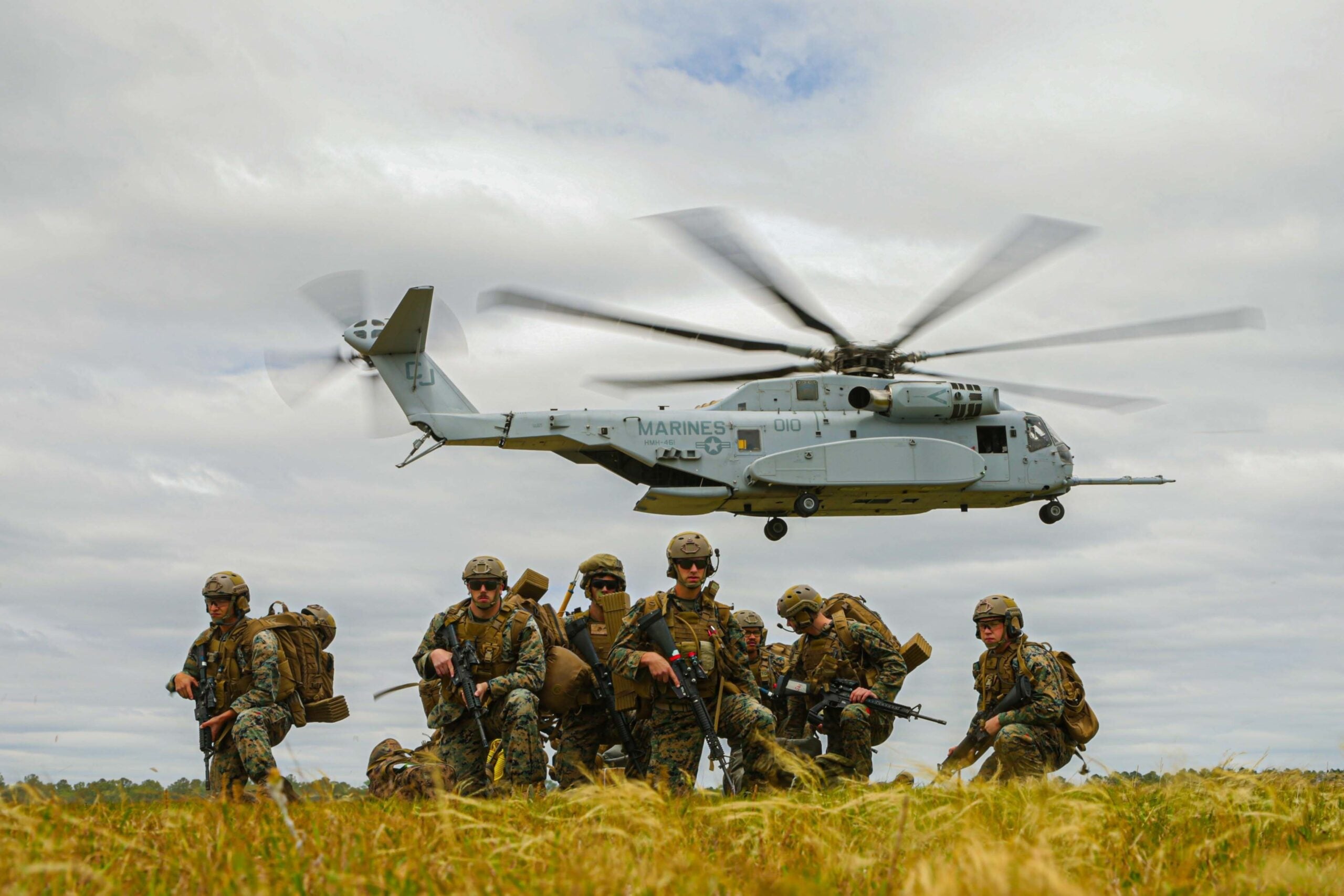 U.S. Marines with 2nd Landing Support Battalion, Combat Logistics Regiment 27, 2nd Marine Logistics Group, assess the landing zone after debarking a CH-53K King Stallion during exercise Potomac Restore, at Oak Grove, North Carolina May 11, 2022. Exercise Potomac Restore is a scenario-driven regimental exercise designed to get the regimental staff to operate in tactical support environments and incorporate unique capabilities of subordinate battalions. (U.S. Marine Corps Photos by Lance Cpl. Jackson Kirkiewicz)