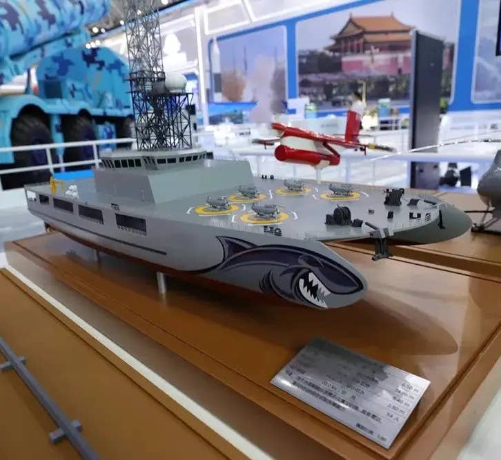 A model of a catamaran-hulled ship officially intended for use as a drone swarm mothership during training exercises on display at the 2021 Zhuhai Airshow. This ship was launched last year. <em>Chinese Internet</em>