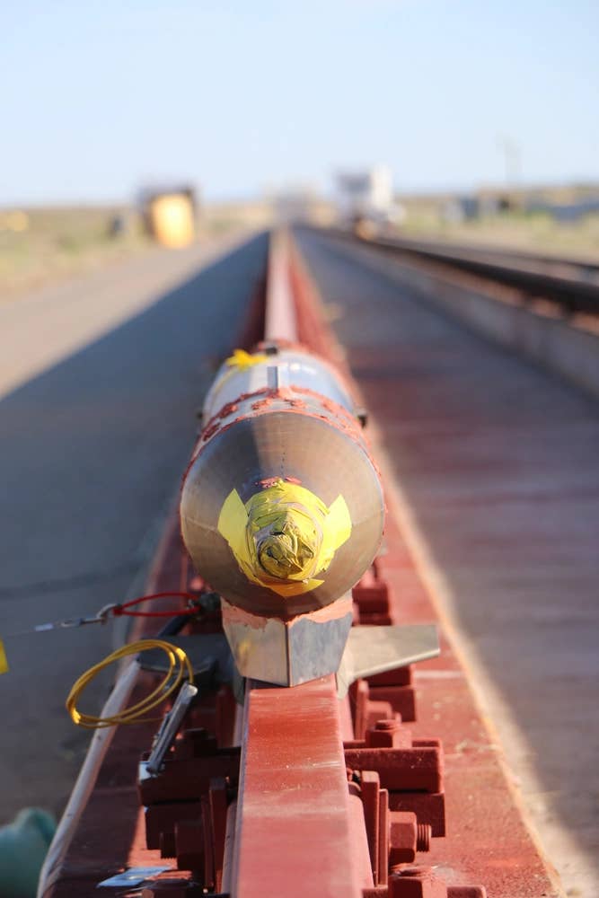 A rocket sled is shown just before launch on the Holloman High-Speed Test Track at Holloman Air Force Base, New Mexico. The 9-inch monorail sled was launched as part of the Hypersonic Readiness program,&nbsp;April 23, 2020. <em>U.S. Air Force</em>