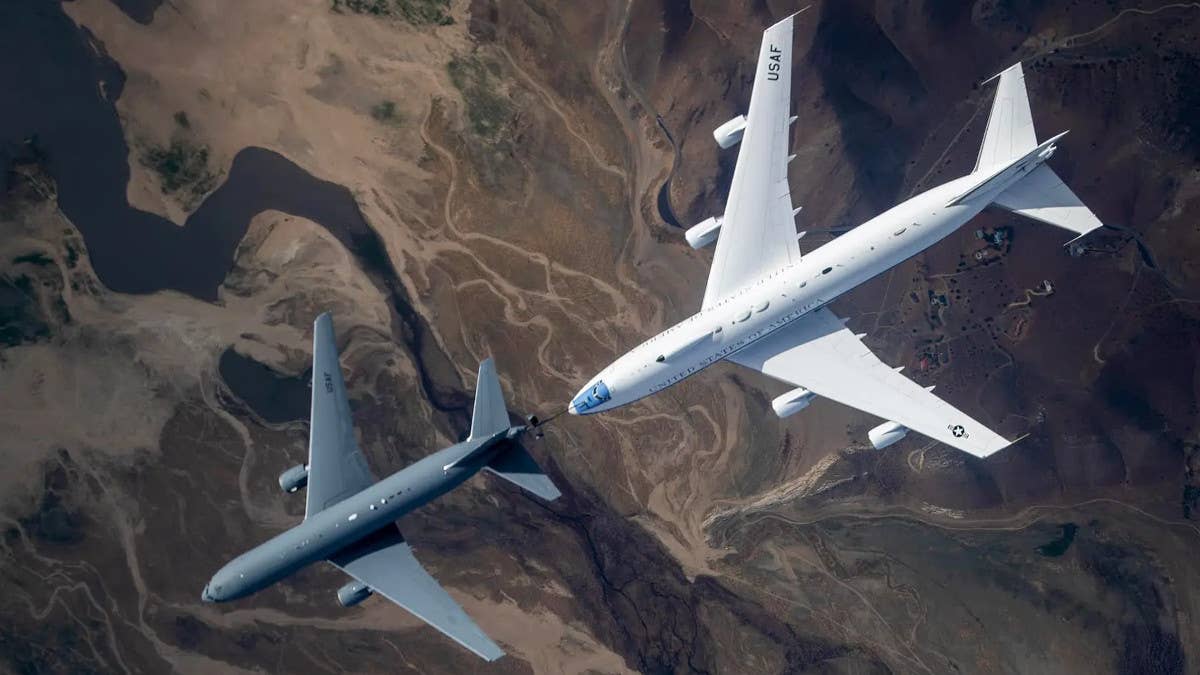 A KC-46A tanker and an E-4B flying above Southern California during an aerial refueling trial.&nbsp;<em>U.S. Air Force</em>
