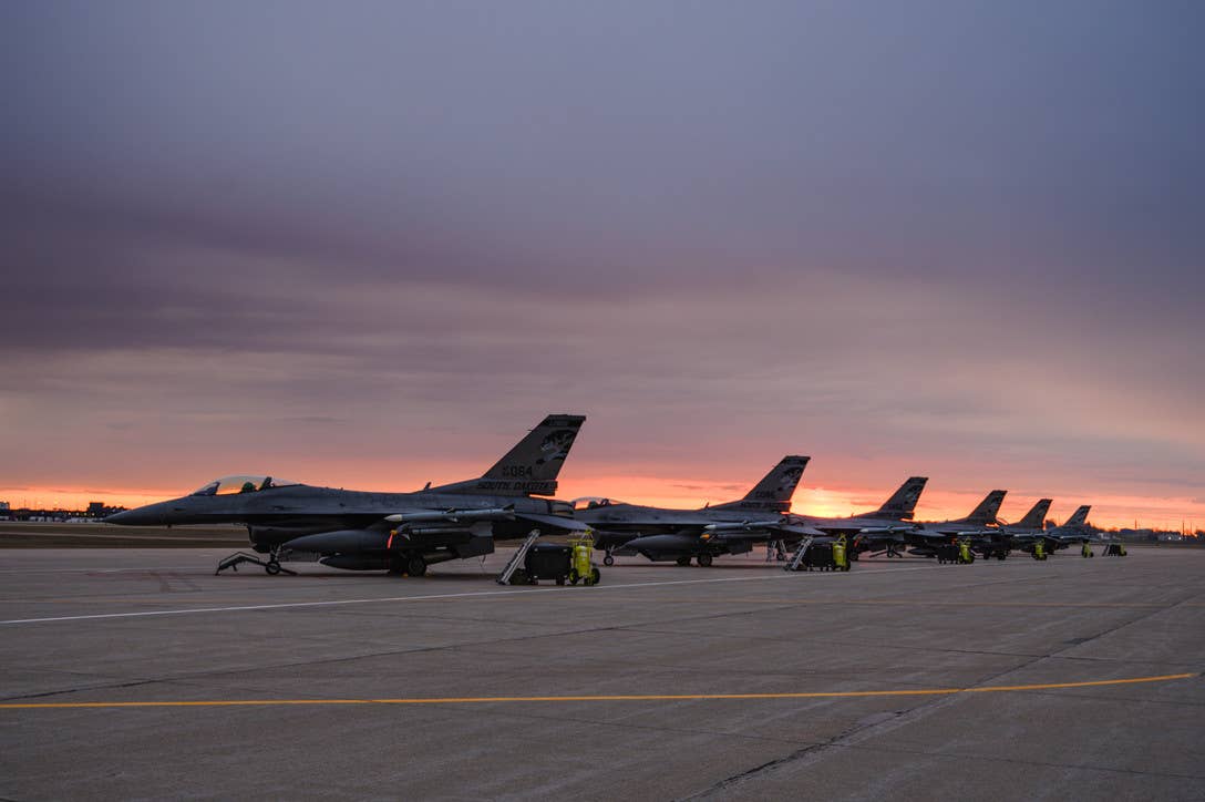 F-16 Fighting Falcons parked on the flightline prior to a sortie at Joe Foss Field, Sioux Falls, S.D.<em> U.S. Air Force</em>