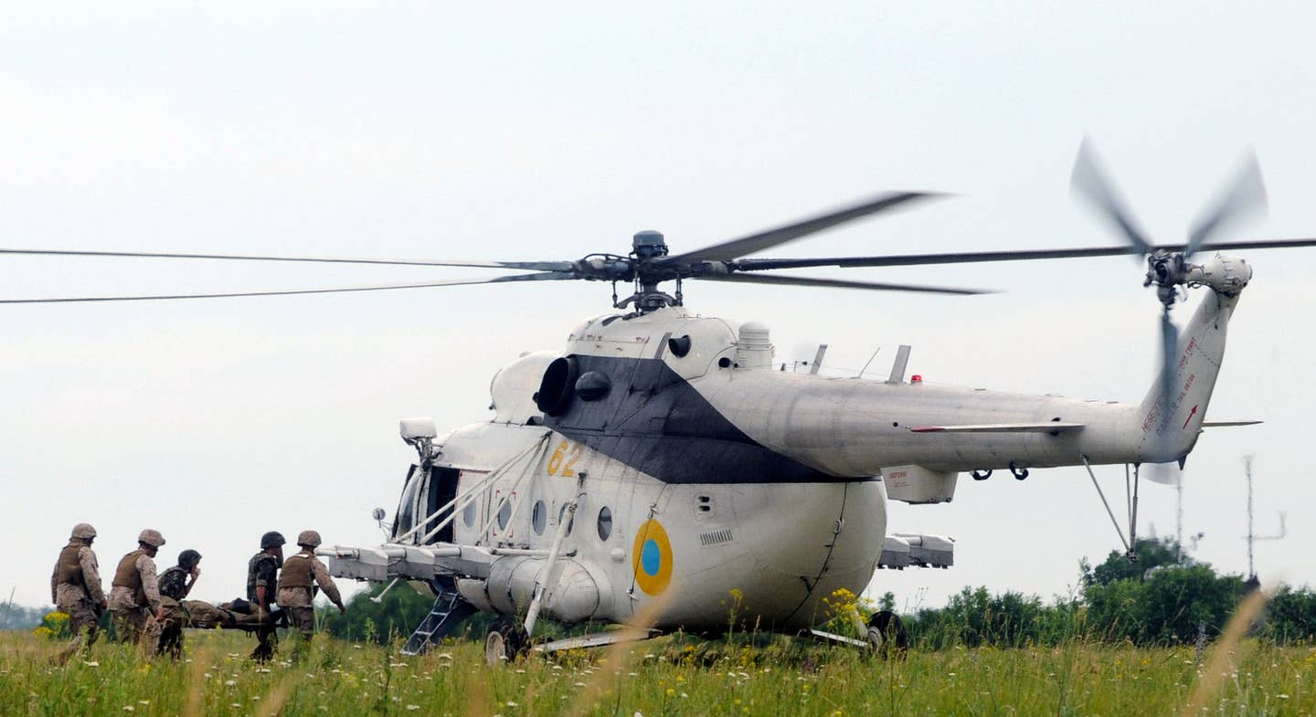 A Ukrainian Mi-8 is loaded with wounded during the multi-national exercise Sea Breeze. (USN Photo)