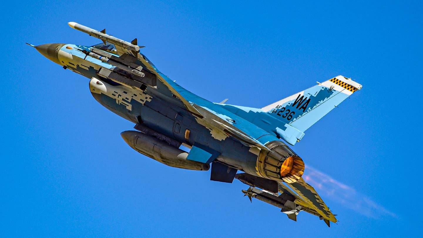 An aggressor F-16C takes-off from Nellis AFB. <em>Jamie Hunter</em>