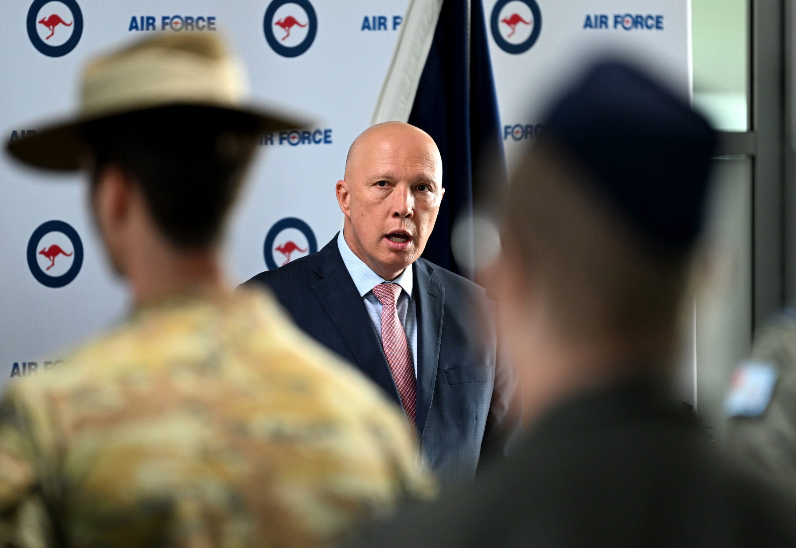 IPSWICH, AUSTRALIA - APRIL 08: Australian Defence Minister Peter Dutton speaks at a Defence medal ceremony at Amberley Air Base on April 08, 2022 in Ipswich, Australia. The Australian Operational Service medal was awarded to the Australian Defence Force (ADF) for their role in evacuating over 4,000 Australians, foreign and Afghan nationals and their families from Afghanistan. (Photo by Dan Peled/Getty Images)