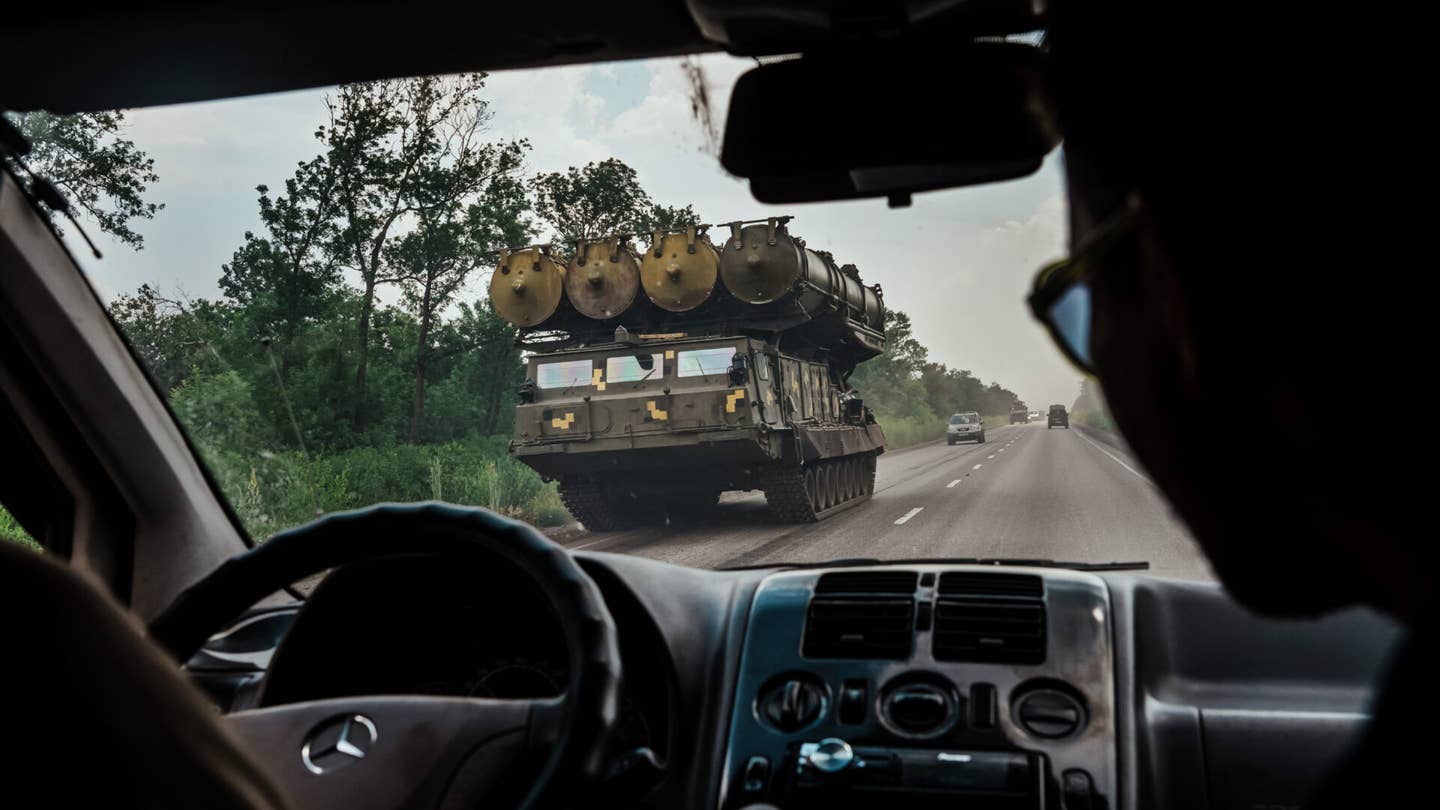 LYSYCHANSK, UKRAINE -- JUNE 12, 2022: A military rocket launcher drives on a highway towards Lysychansk, Ukraine, Sunday June 12, 2022. (Marcus Yam / Los Angeles Times via Getty Images)