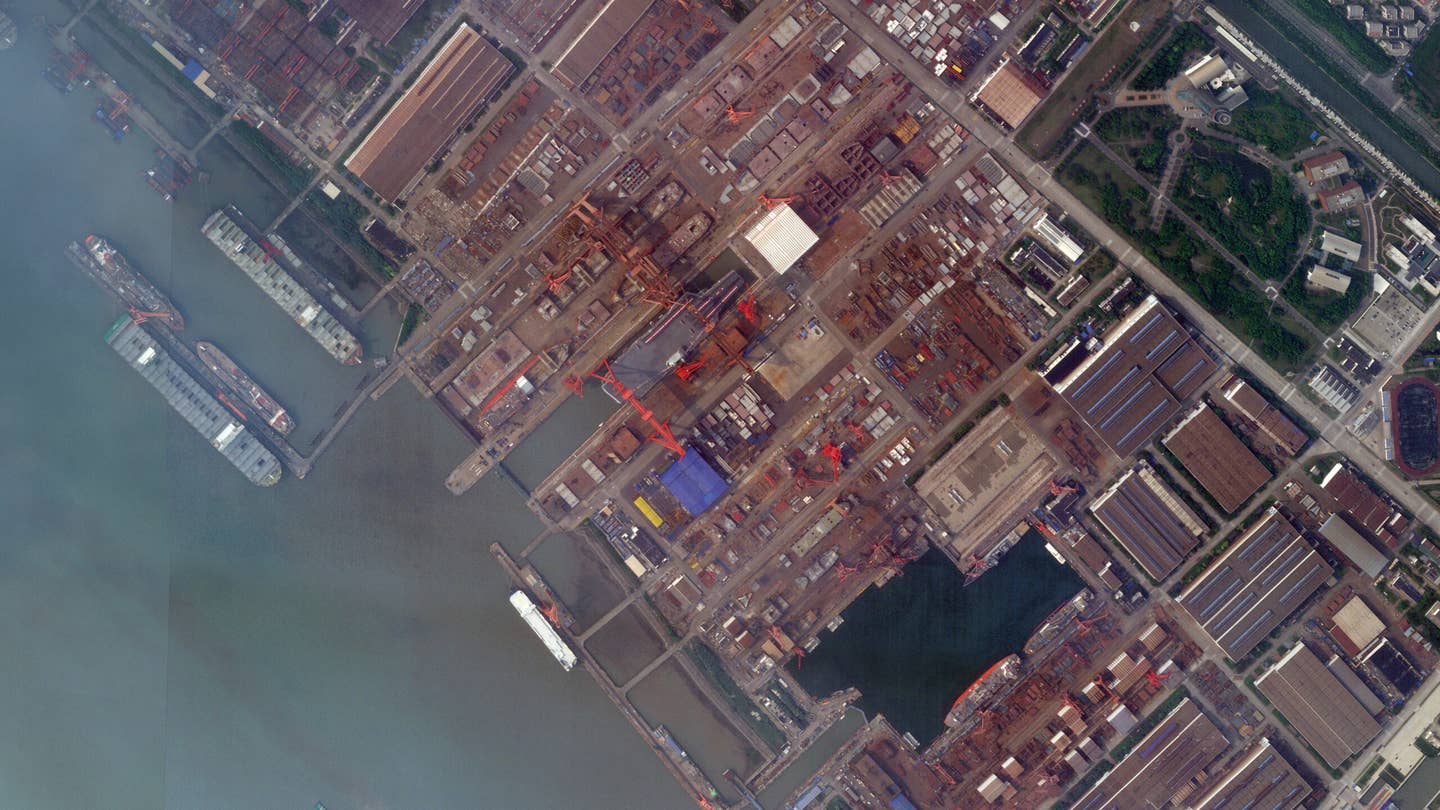 <em>C</em>hina's still-under-construction Type 003 aircraft carrier at Jiangnan Shipyard on June 14. The dry dock has clearly been flooded, at least partially.<em> PHOTO © 2022 PLANET LABS INC. ALL RIGHTS RESERVED. REPRINTED BY PERMISSION</em>