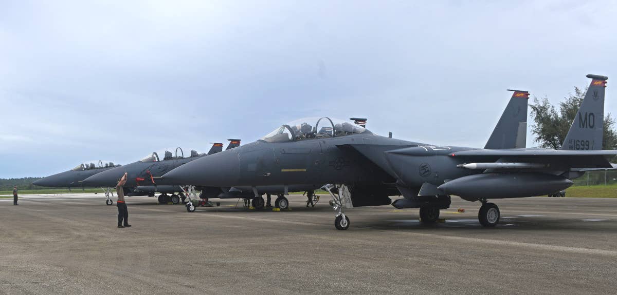 US Air Force F-15E Strike Eagle combat jets at Tinian International Airport during Exercise Pacific Iron 21. <em>USAF / Tech. Sgt. Benjamin Sutton</em>