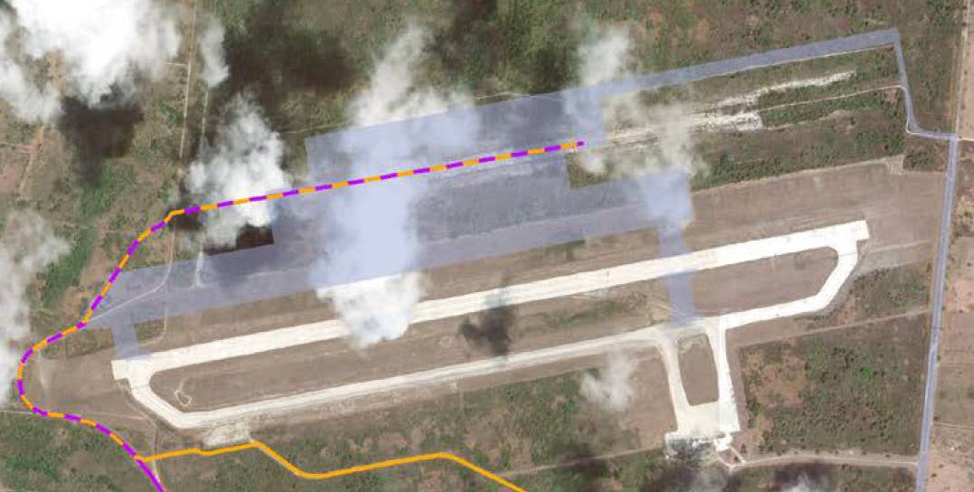 An annotated satellite image of Tinian International Airport with the planned locations of the new parking apron and taxiway that are now under construction as part of the Tinian Divert Airfield project shown in gray. The purple and yellow lines are portions of two proposed routes for a fuel pipeline that is also part of the complete construction effort. <em>USAF</em>
