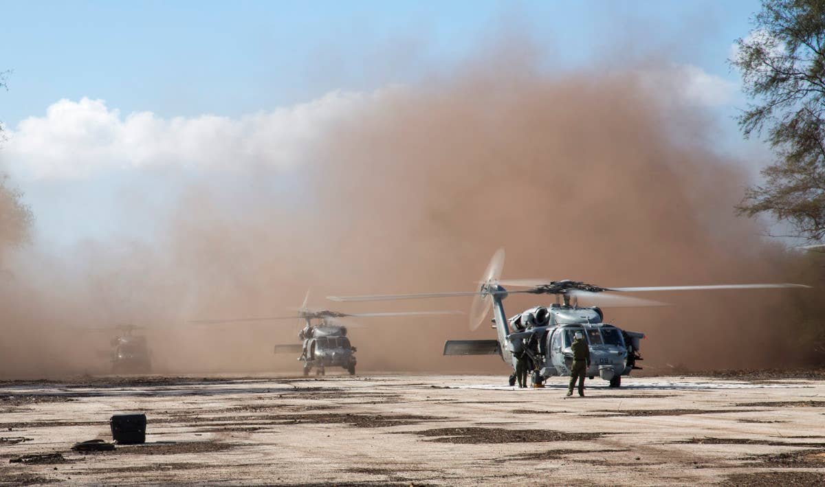 US Navy MH-60 Seahawk helicopters operating from Tinian's North Field during an exercise in 2013. <em>USMC / Lance Cpl. Antonio Rubio</em>