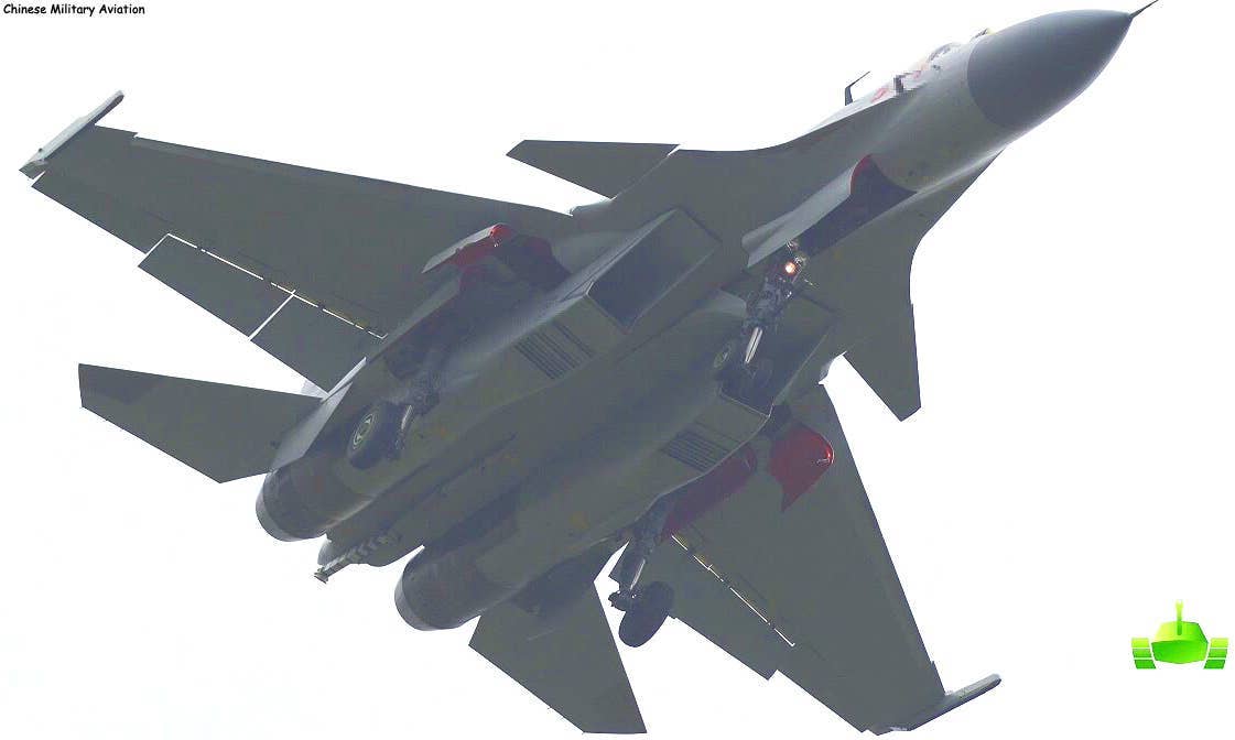 An inflight view of a prototype J-15T, apparently used to test the beefed-up landing gear and catapult launch bar required for CATOBAR operations.&nbsp;<em>via Andreas Rupprecht</em>