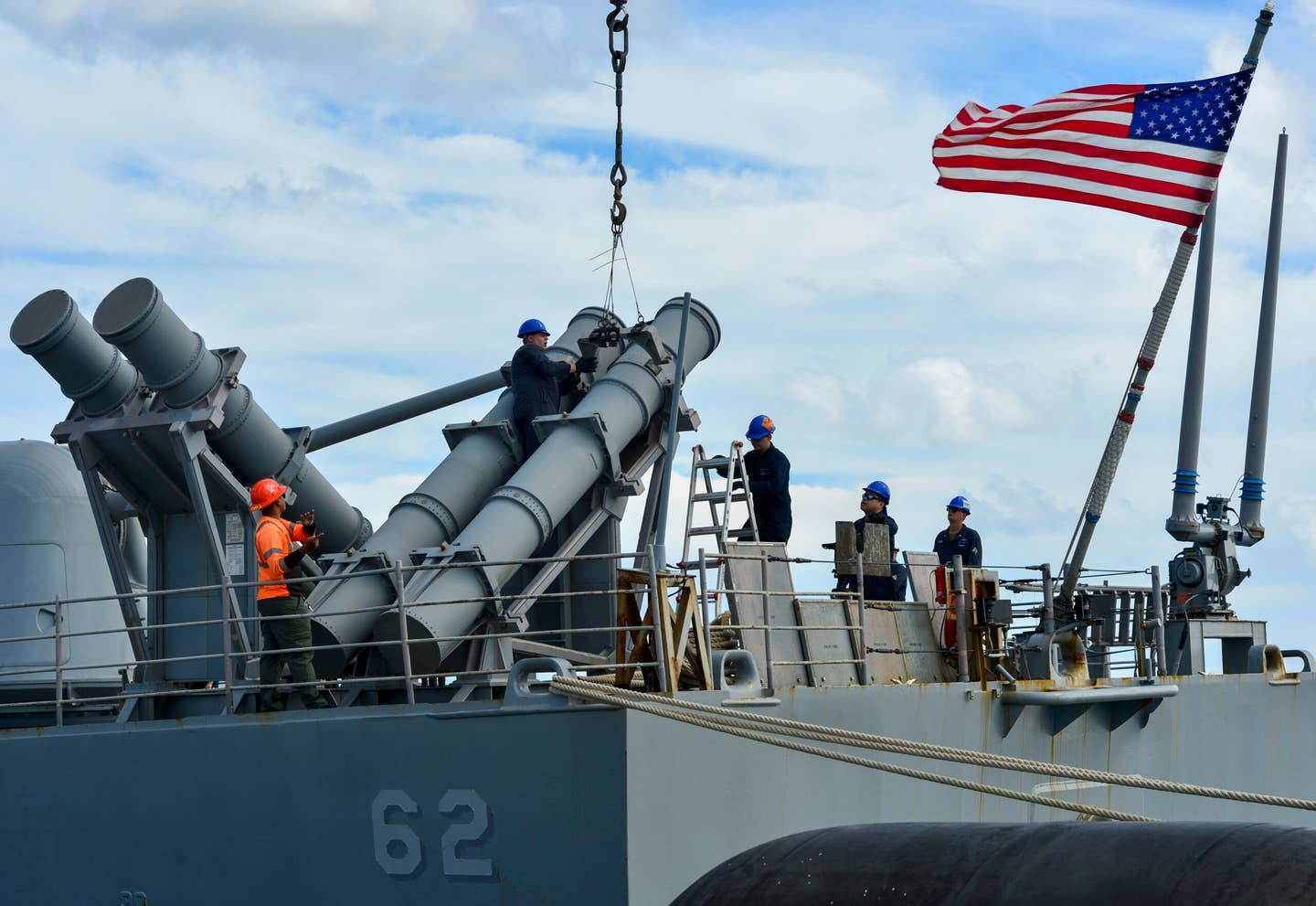 Sailors assigned to the <em>Ticonderoga</em> class guided-missile cruiser USS <em>Chancellorsville</em> (CG-62) install a Mk 141 Harpoon missile launcher during a weapons upload in support of Valiant Shield 2022. <em>U.S. Navy photo by Hospital Corpsman 2nd Class Jan Jason Flores</em>