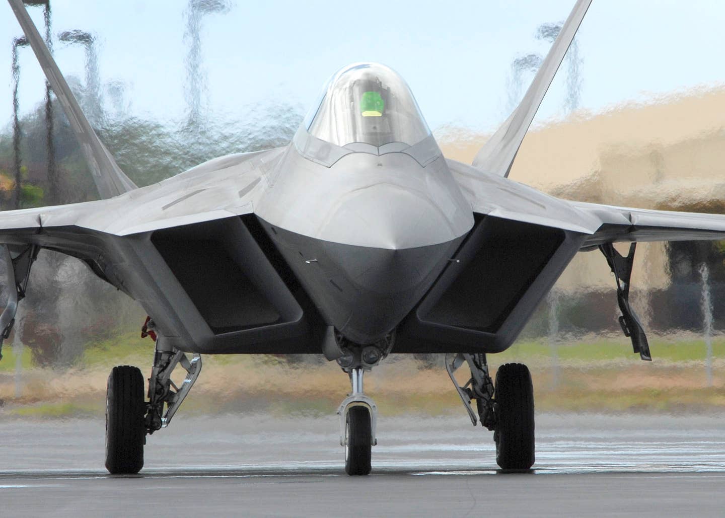 A pilot taxies in an F-22 at Joint Base Pearl Harbor-Hickam, Hawaii. <em>U.S. Air Force photo/Tech Sgt. Jerome S. Tayborn</em>