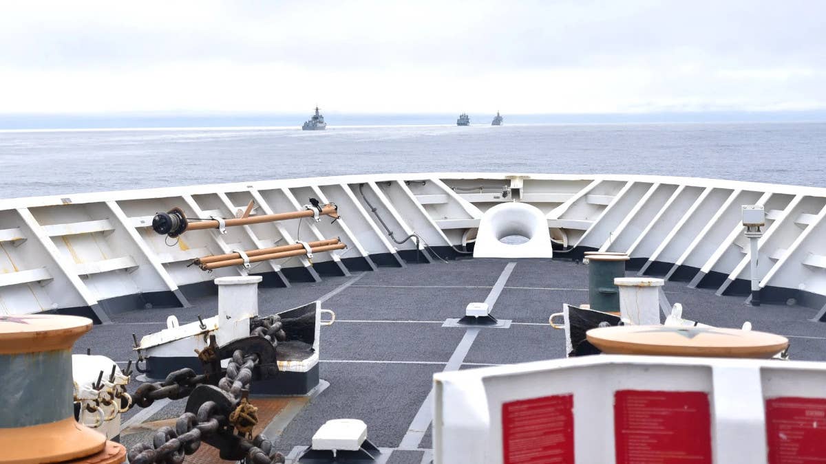 Three Chinese naval vessels, a seen from the deck of the US Coast Guard's <em>Legend</em> class cutter USCGC <em>Bertholf</em>, sail near the Aleutian Islands in August 2021.