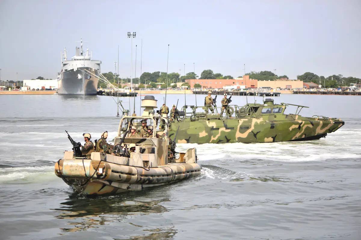 Small Unit Riverine Crafts (SURC), an example of which is seen here in front, and Riverine Command Boats (RCB), as seen in the background, could be among the patrol boats now destined for Ukraine. <em>USN</em>