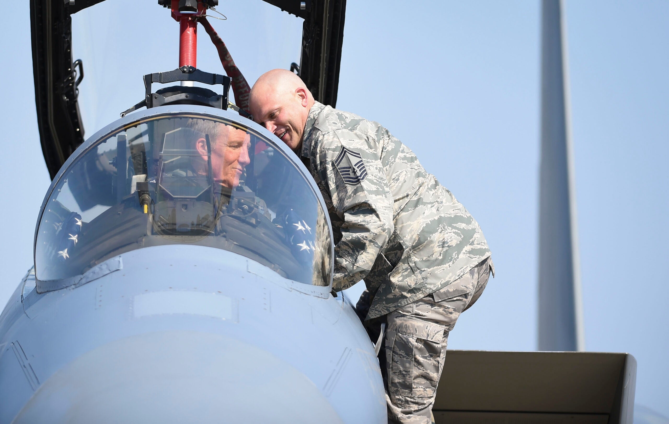 U.S. Air Force Gen. Herbert “Hawk” Carlisle, commander of Air Combat Command, goes over a preflight maintenance check with U.S. Air Force Senior Master Sgt. Jeffrey Zimmerman, 78th Aircraft Maintenance Unit superintendent, prior to his final flight at Joint Base Langley-Eustis, Va., March 9, 2017. Zimmerman was Carlisle’s first crew chief and was invited to lead the general’s final launch. (U.S. Air Force photo/Staff Sgt. Natasha Stannard)