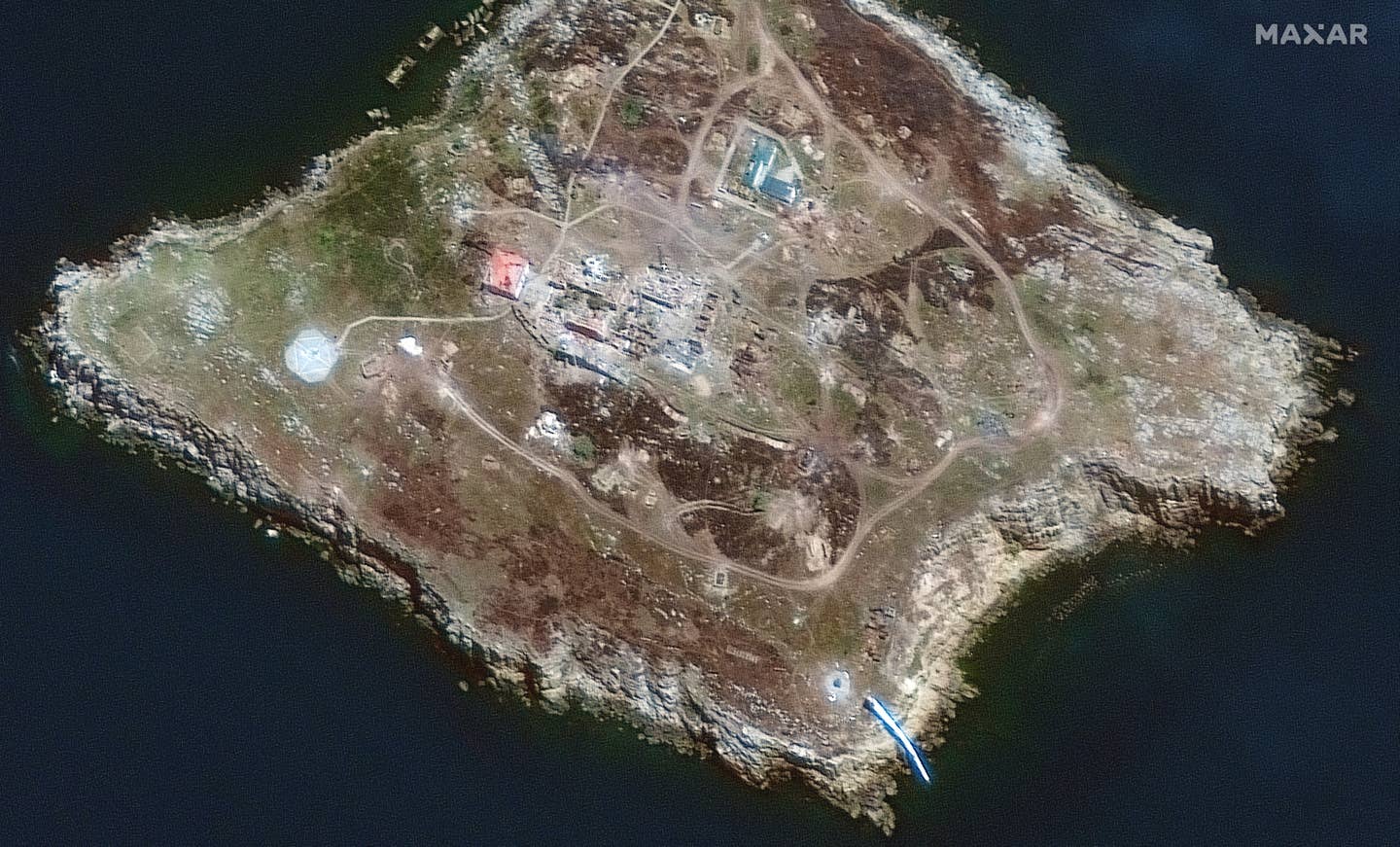 A closer view of the southern end of Snake Island, on June 30.  Most structures on the island are now destroyed. <em>Maxar</em>